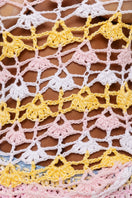 Handmade crochet top by Andreeva featuring vibrant pink and yellow colors, showcasing intricate crochet patterns.