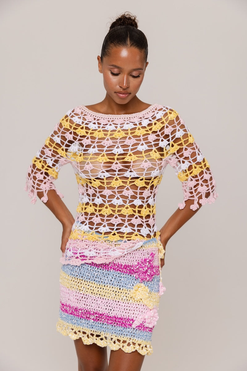 Handmade crochet top by Andreeva featuring pink and yellow floral designs, perfect for casual or summer wear.