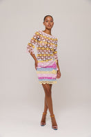Handmade crochet top in pink and yellow with a vibrant bird of paradise pattern, by Andreeva, featuring intricate detailing.