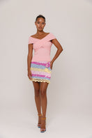 Pink knit top by Andreeva featuring a cozy, stylish design with long sleeves and a ribbed texture.