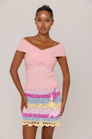 Pink knit top by Andreeva featuring a cozy, stylish design, perfect for casual wear, shown on a model.