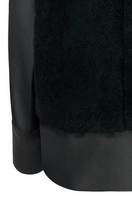 Black Olympia sweater by Lorena Saravia, featuring a stylish back design, made of soft, cozy fabric, perfect for casual wear.