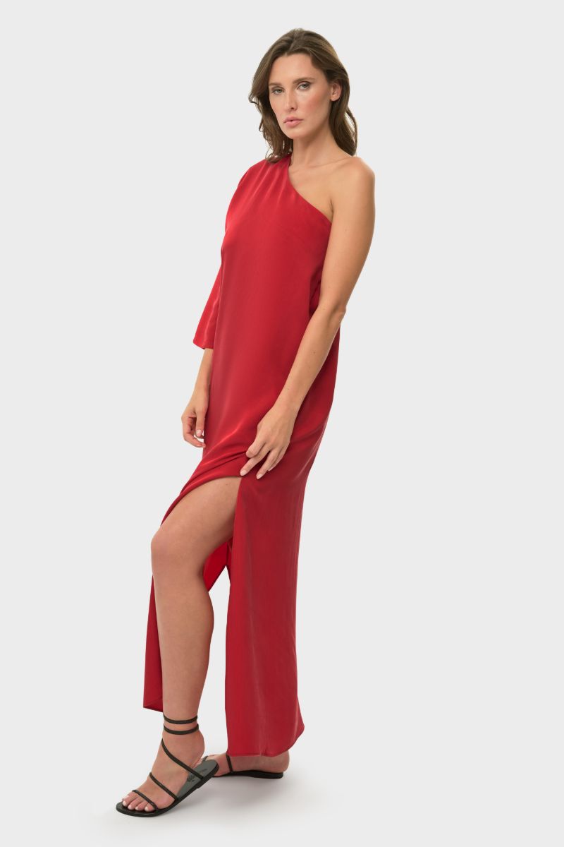 NiLuu one-shoulder maxi dress in vibrant rouge fabric, flowing and elegant, perfect for summer or special occasions.