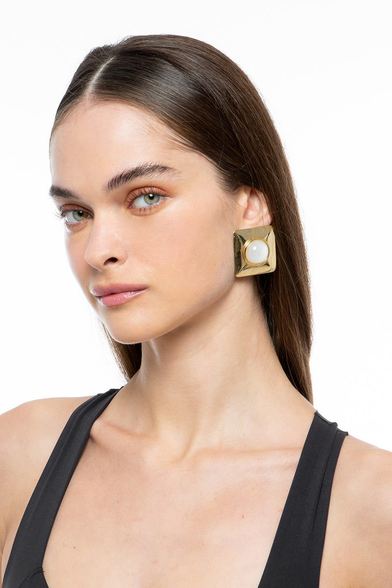 Silvia Gnecchi EMMA earrings featuring elegant silver hoops with intricate detailing.