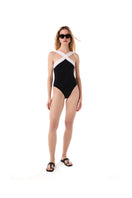Black Orchid swimsuit by KIÓHNE featuring a sleek, fitted design with adjustable straps, ideal for stylish beachwear.