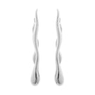 Silver earrings by Eugenia Ospina featuring elegant, handcrafted designs with intricate details for stylish accessories.