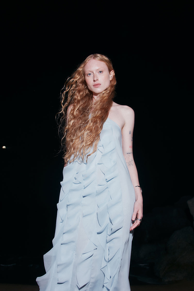 Sky blue AQUA dress by OVERTHESEA, a stylish maxi dress with flowing fabric and elegant design.
