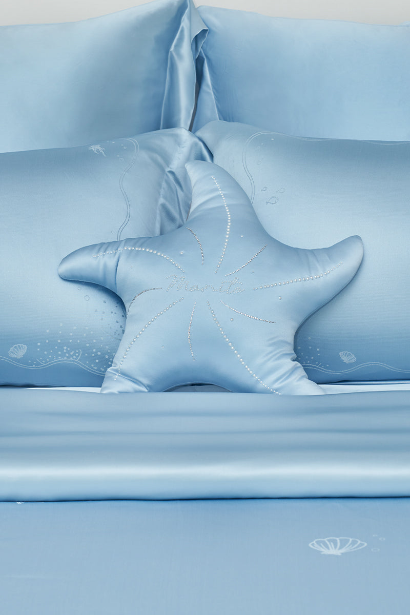 Blue Ocean Starfish Throw Pillow by MANITO, featuring a marine-inspired starfish design for home decor accents.