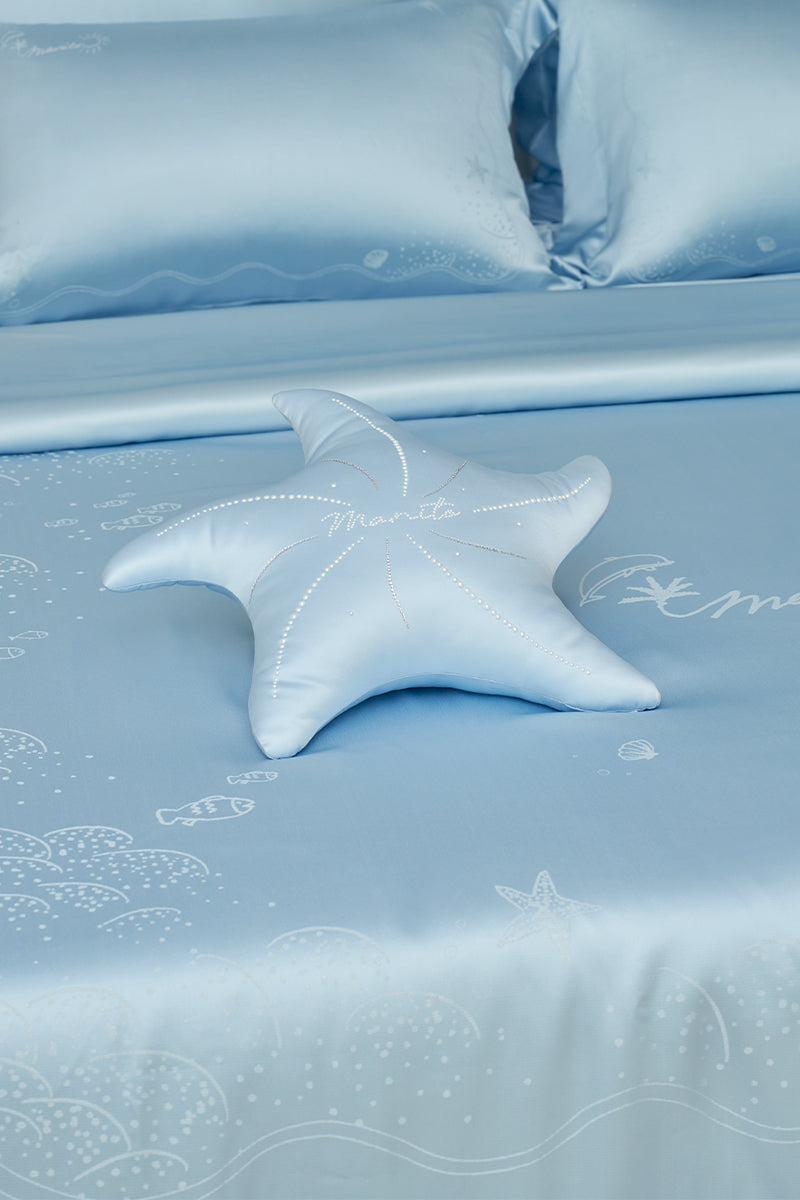 Blue Ocean Starfish throw pillow by MANITO, featuring a coastal starfish design, perfect for home decor.