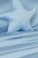 Blue Ocean Starfish throw pillow by MANITO, featuring a starfish design, perfect for coastal or beach-inspired home decor.