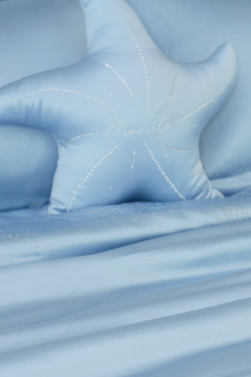 Blue Ocean Starfish throw pillow by MANITO, featuring a starfish design, perfect for coastal or beach-inspired home decor.