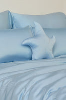 Blue Ocean Starfish throw pillow by MANITO, featuring a nautical starfish design, perfect for coastal home decor.