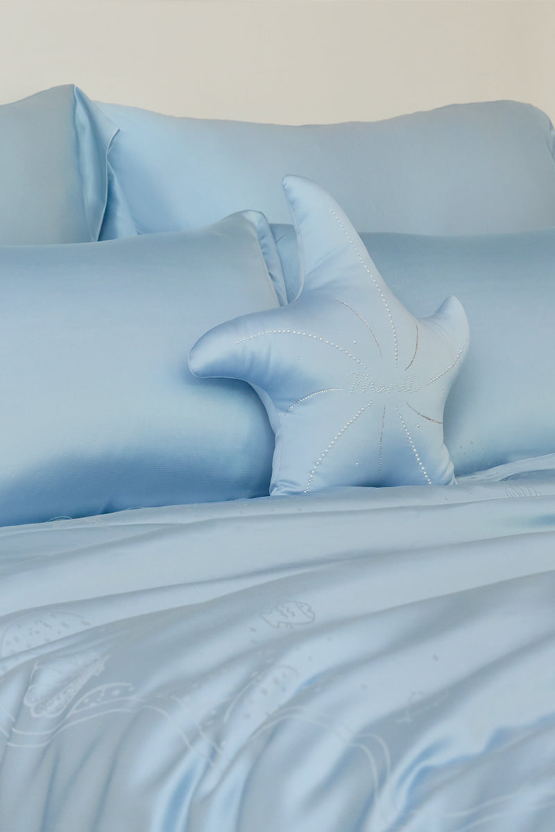 Blue Ocean Starfish throw pillow by MANITO, featuring a nautical starfish design, perfect for coastal home decor.