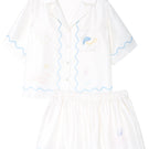 Manito Ocean Wave silk short pajama set for women, featuring a lightweight, silky fabric with a wave pattern and short sleeves.