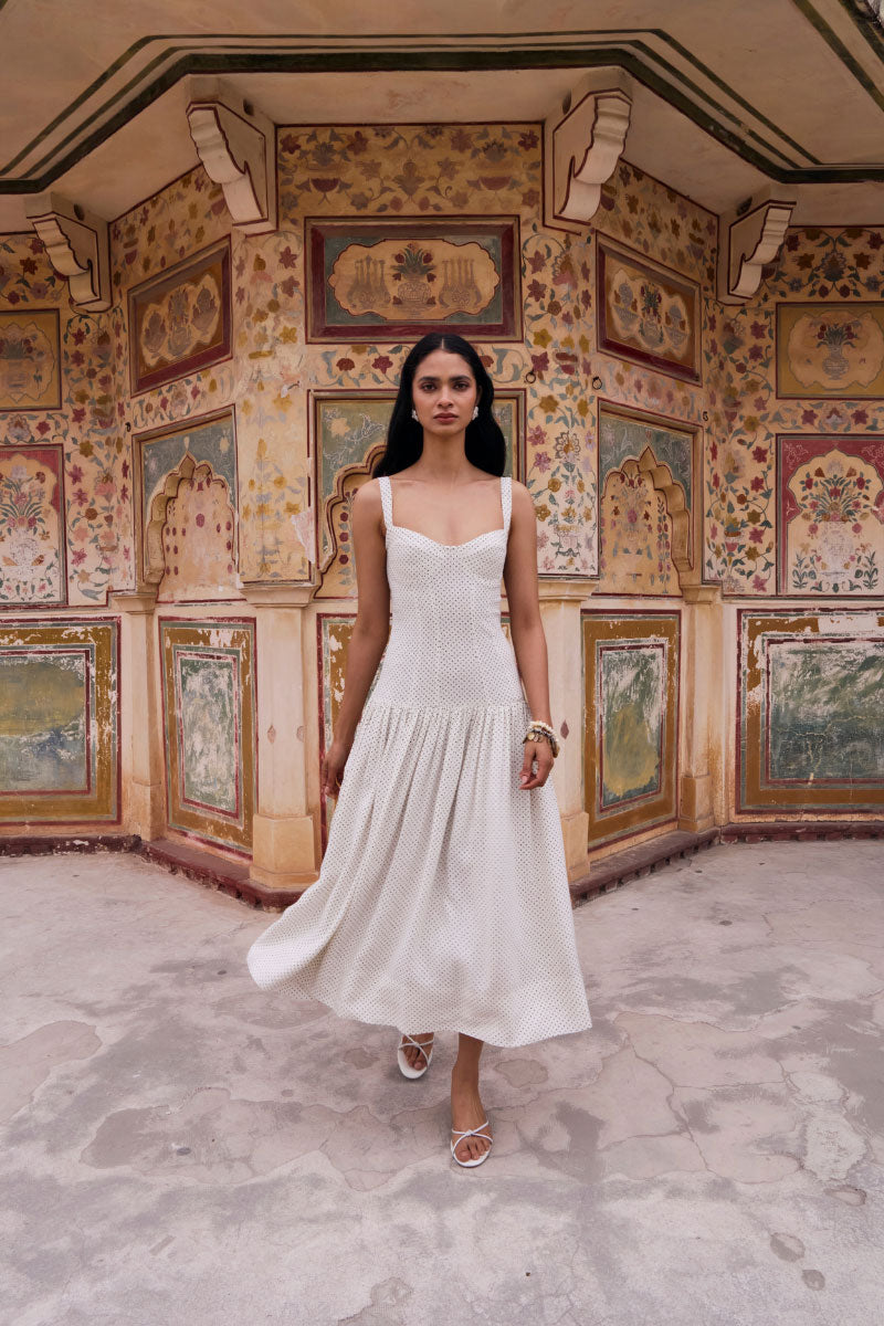 Ivory dotted midi dress from Summer Away's Odessa collection, featuring a flowy silhouette and elegant design.