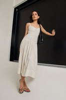 Ivory dot midi dress from Summer Away's Odessa Dress collection, featuring a feminine, flowy design with a fitted waist.