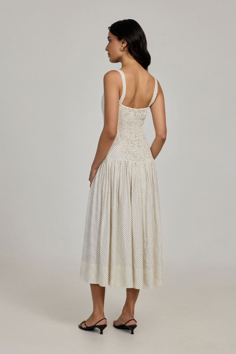 Ivory dot midi dress from Summer Away's Odessa collection, featuring a flowy fabric and stylish design for elegant summer wear.