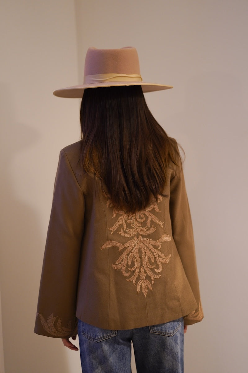Nadya Shah Odessa jacket shown from the back, stylish tailored jacket with a sleek fit and modern design.