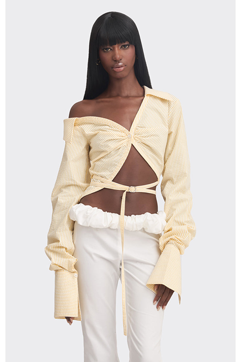 Yellow striped off-shoulder cropped top from Stolen Stores, featuring a stylish and trendy design with exposed shoulders.