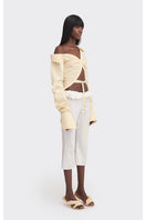Yellow off-shoulder cropped striped shirt from Stolen Stores, stylish tops with a relaxed fit and bold pattern.