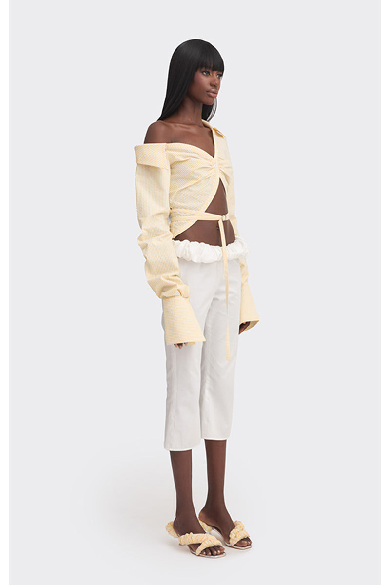 Yellow off-shoulder cropped striped shirt from Stolen Stores, stylish tops with a relaxed fit and bold pattern.