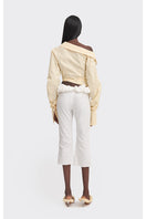 Yellow off-shoulder cropped stripe shirt by Stolen Stores, stylish tops with a relaxed fit and bold stripe pattern.