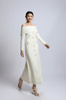White off-shoulder long shift dress from Valenciani, elegant maxi dress with flowing fabric and stylish off-shoulder design.