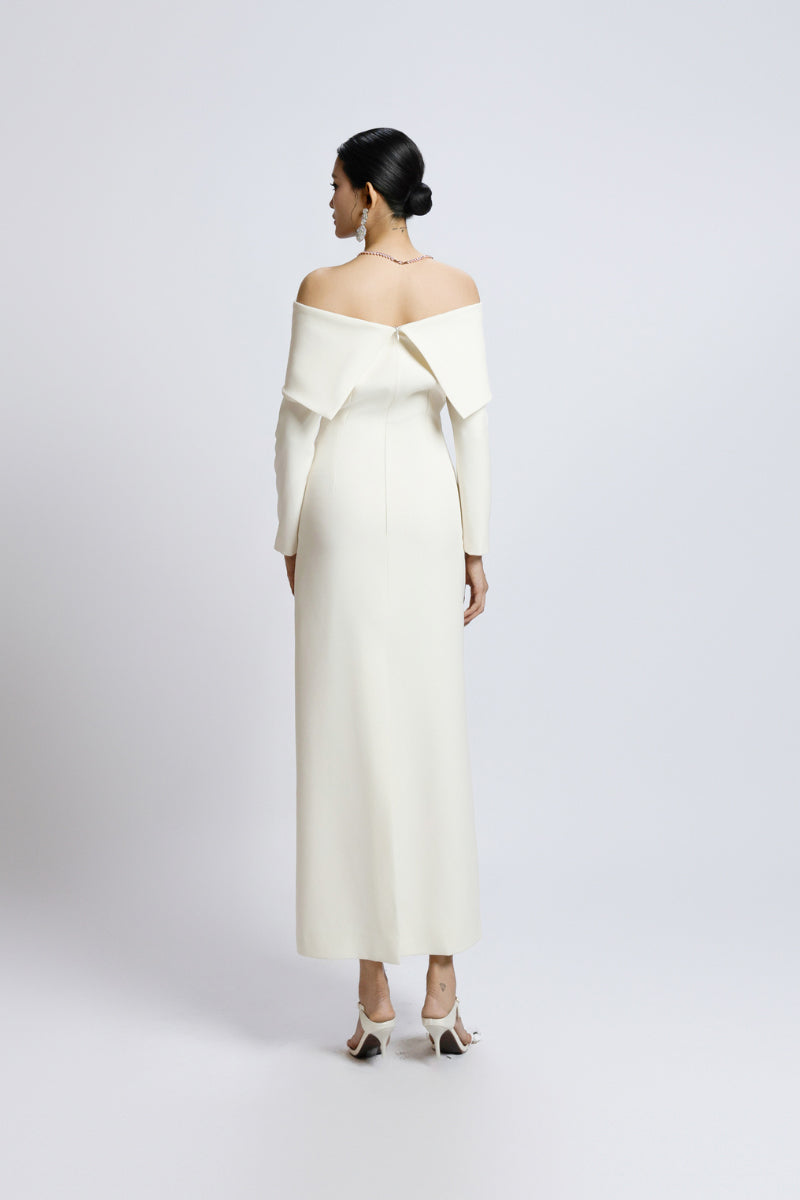 White off-shoulder long shift dress by Valenciani, stylish maxi dress with flowing fabric and elegant neckline.