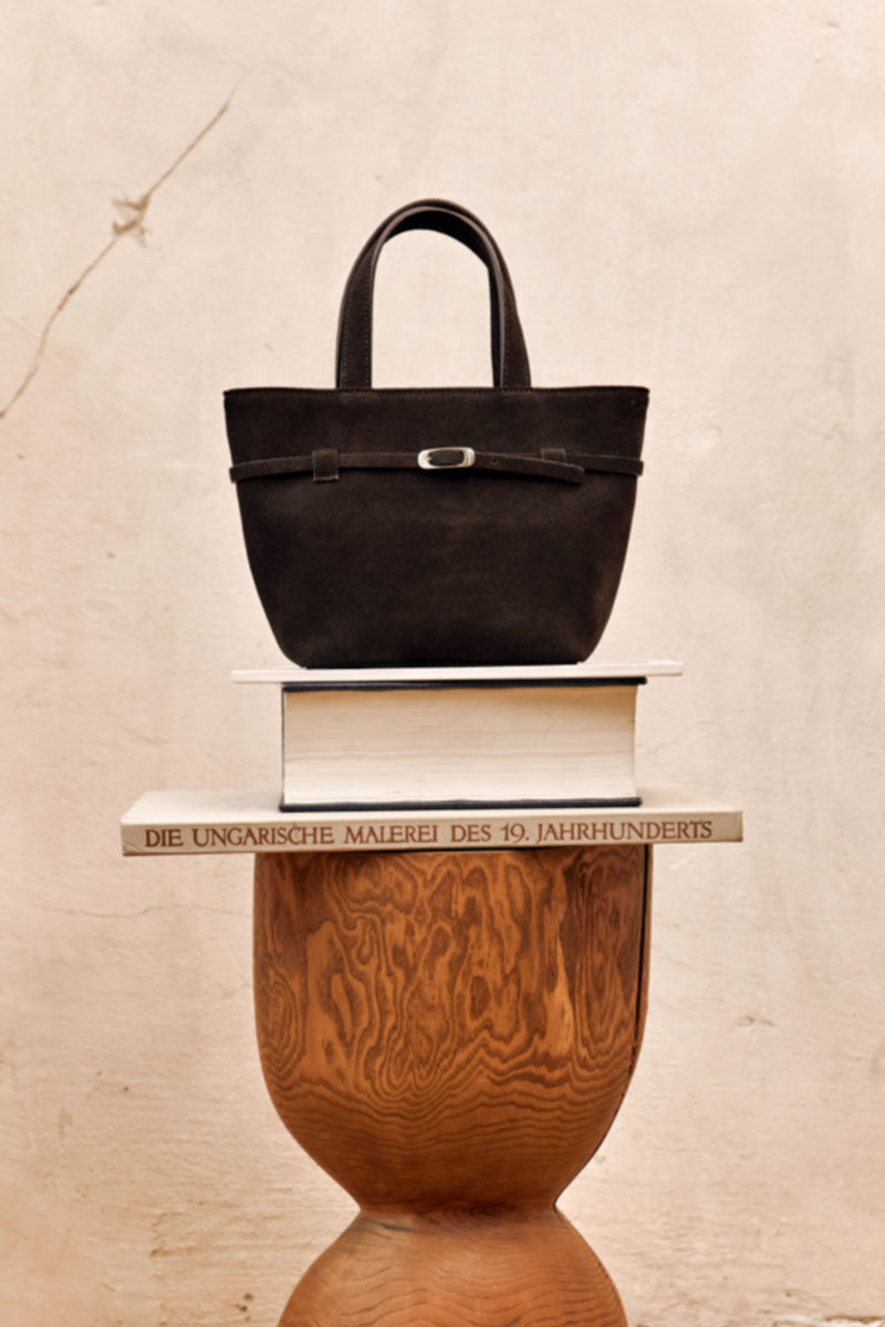 TUEAM'S Olvia brown crossbody bag with top handle, sleek design, and versatile style for everyday use.