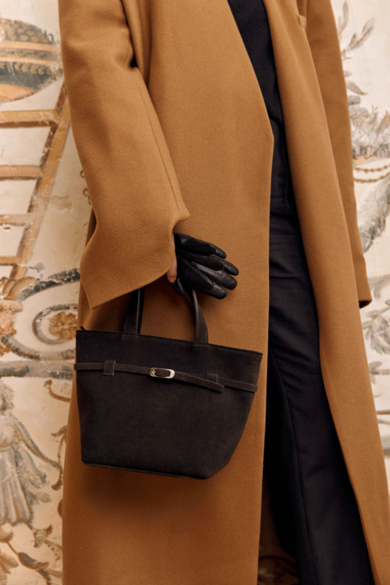 TUEAM'S Olvia brown crossbody bag with top handle, featuring a sleek design and adjustable strap for versatile style.