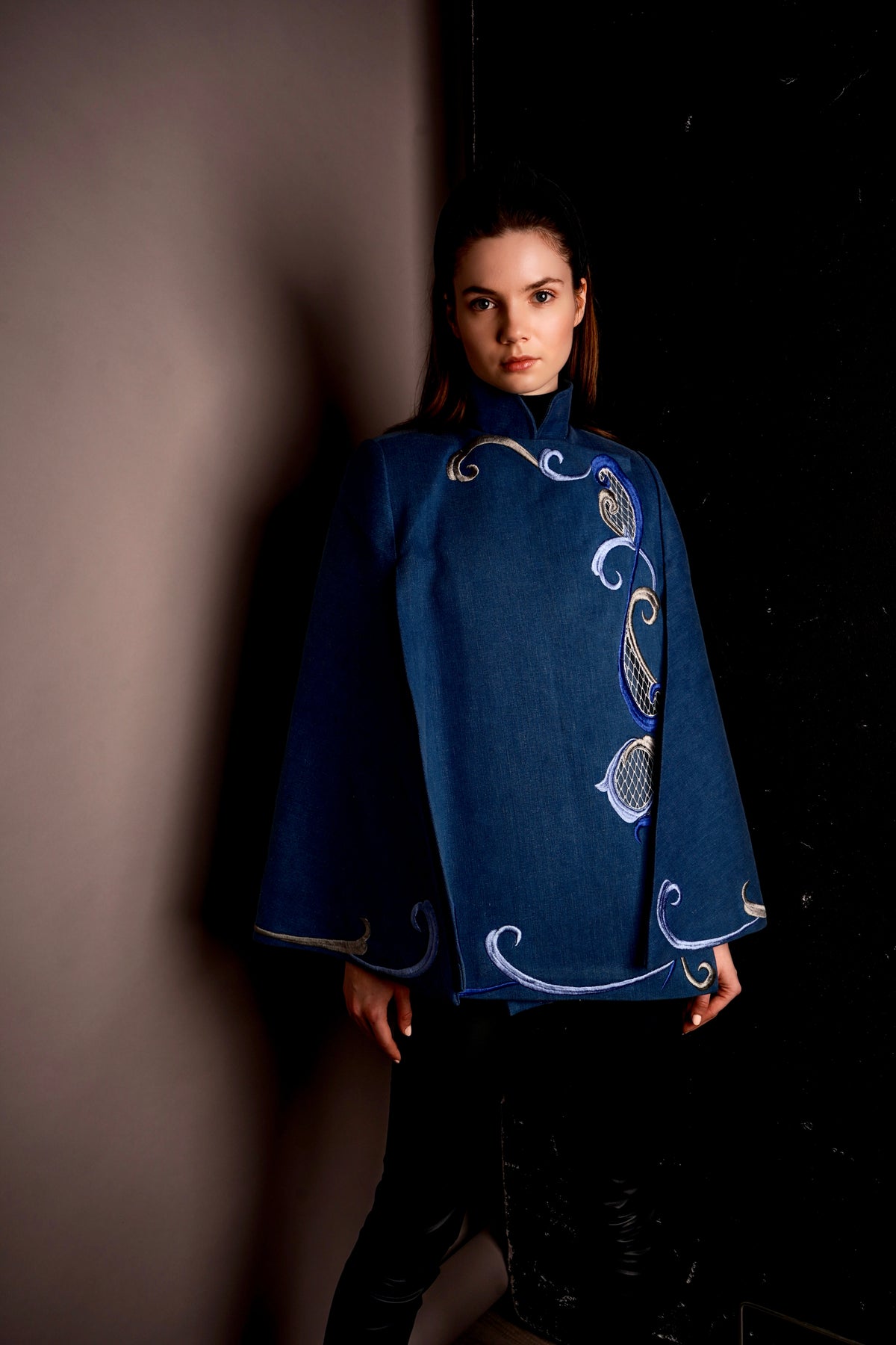 Nadya Shah Olympia denim cape jacket with stylish design, featuring denim fabric and a relaxed fit, displayed on a plain background.