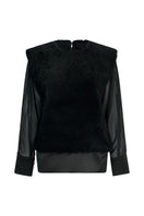 Black Olympia sweater by Lorena Saravia, a stylish knit top with a relaxed fit and subtle texture, shown on a model.