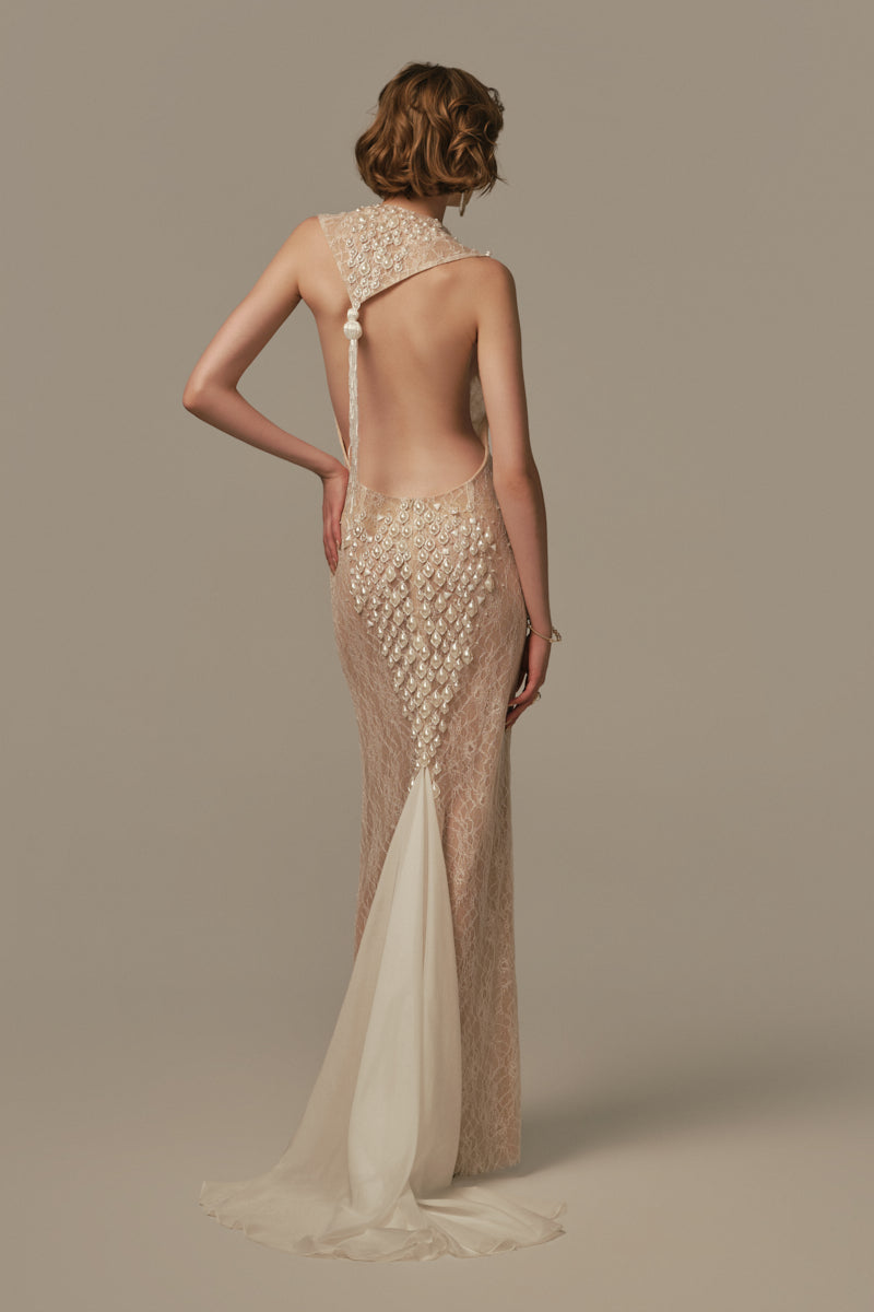 White ONDINE gown by POEM featuring elegant flowing fabric and a relaxed fit, shown on a model.