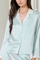 Green silk women's pajama set by MANITO featuring a comfortable, elegant design with long sleeves and a relaxed fit.