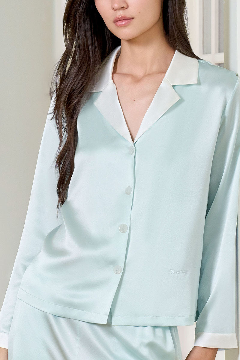 Green silk women's pajama set by MANITO featuring a comfortable, elegant design with long sleeves and a relaxed fit.