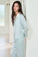 Green silk women's pajama set by MANITO featuring a comfortable, elegant design with long sleeves and matching pants.