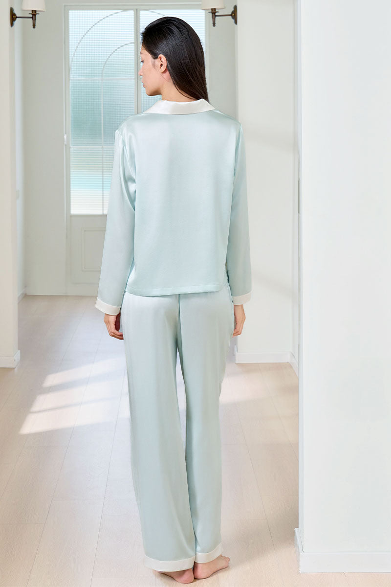 Green silk women's pajama set by MANITO, featuring a comfortable, elegant design with long sleeves and matching pants.