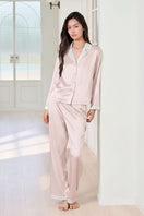 Pink silk pajama set for women by MANITO featuring a comfortable, elegant design with long sleeves and matching pants.