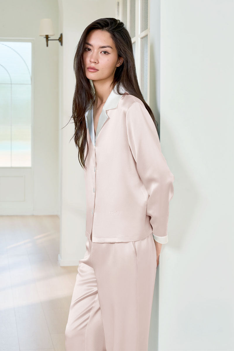 Pink silk pajama set for women by MANITO, featuring a comfortable, elegant design with long sleeves and a relaxed fit.