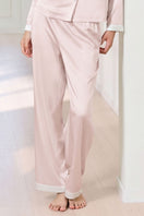 Pink silk pajama set for women by MANITO, featuring a comfortable and elegant design with a relaxed fit and smooth fabric.