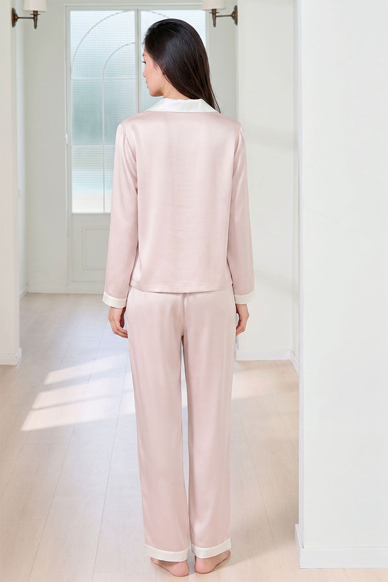 Pink silk women's pajama set by MANITO featuring a comfortable, elegant design with long sleeves and matching pants.