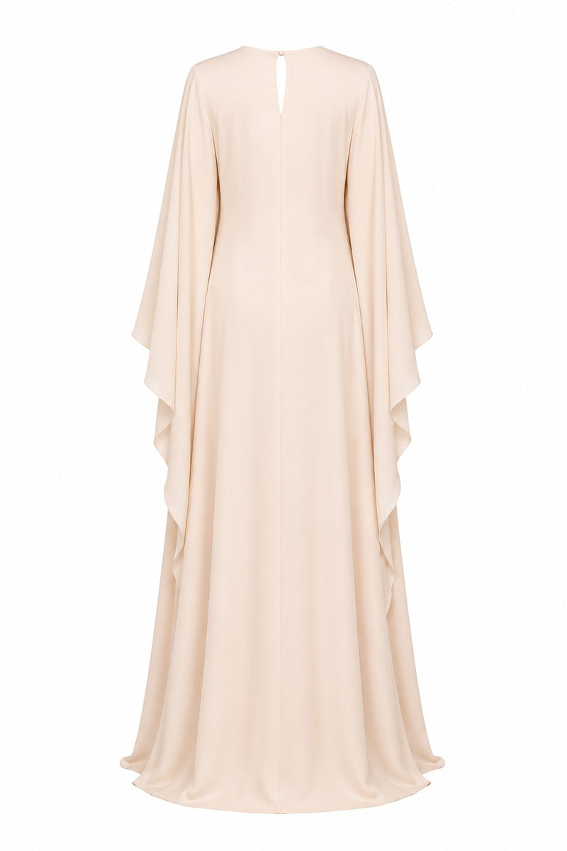 Nihan Peker Opaline vanilla gown with elegant flowing fabric and delicate detailing, perfect for formal occasions.