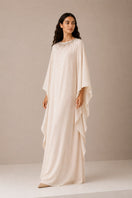 Nihan Peker Opaline dress in vanilla, elegant gown with flowing fabric and intricate details, perfect for formal occasions.