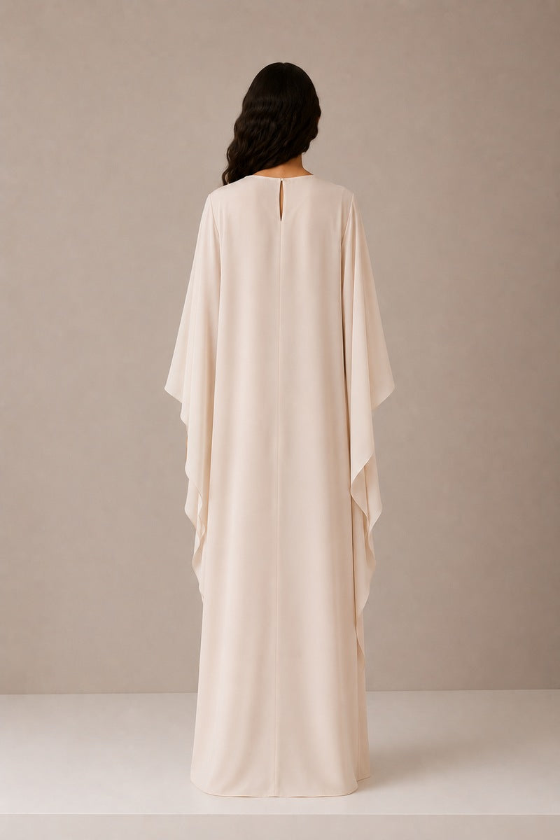 Nihan Peker Opaline vanilla gown with flowing fabric and elegant design, perfect for formal occasions or evening wear.