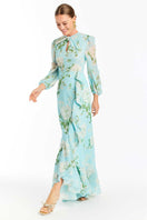 Side view of Mestiza New York Ophelia chiffon gown in blue botanica, a flowing maxi dress with delicate floral details.
