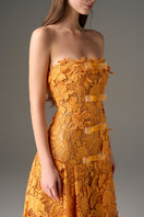Orange floral strapless maxi dress by I.H.F Studio featuring an A-line silhouette and elegant flowing fabric.
