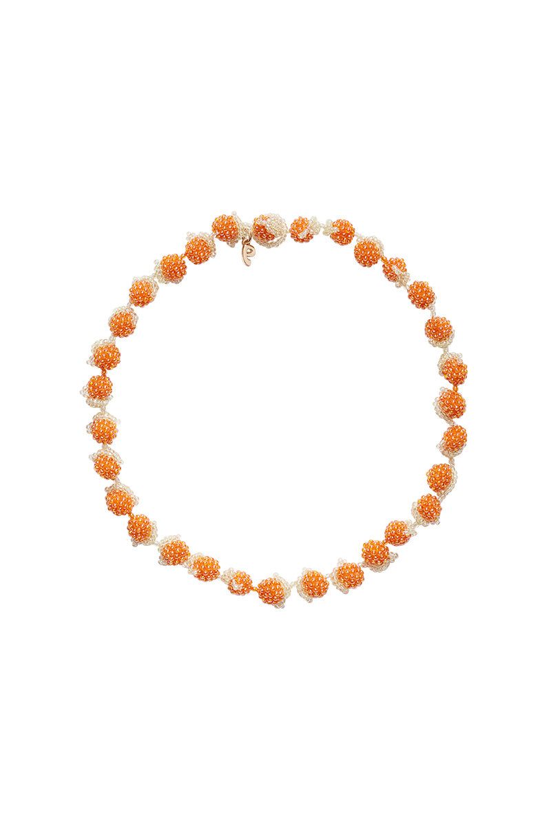 Pura Utz Orange Galore Necklace featuring vibrant orange beads and a stylish pendant, perfect for adding a pop of color to any outfit.