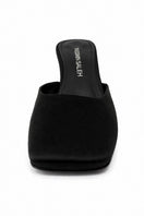 Black Orbit Heels by Yassmin Saleh featuring a sleek ghost-front design, stylish high-heeled footwear for elegant occasions.