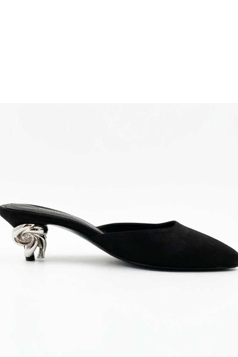 Black Orbit Heels by Yassmin Saleh featuring sleek design and pointed toes, displayed on a ghostly backdrop.