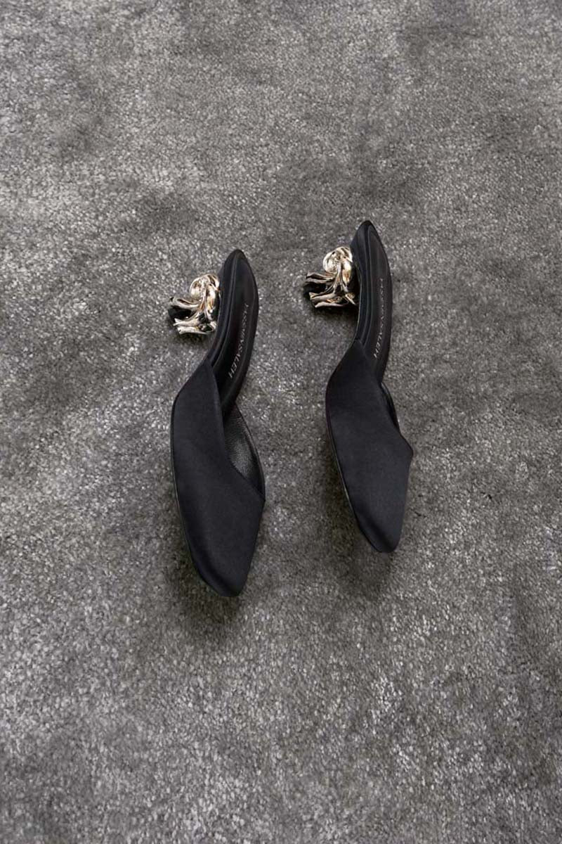 Black Yassmin Saleh Orbit Heels shown from a side view, stylish high heels with sleek design and pointed toe.